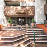 a view of a patio with a table and chairs