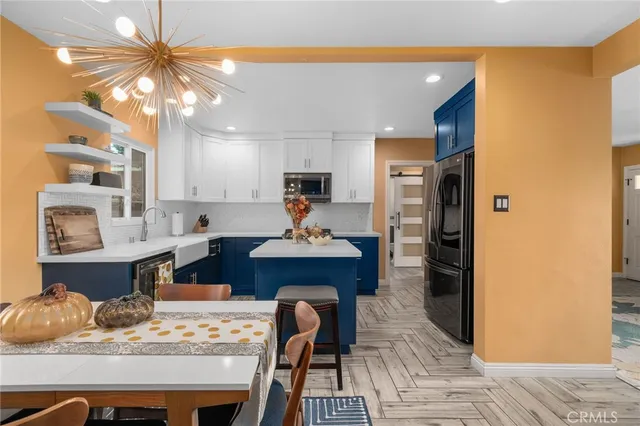 a kitchen with a table and chairs in it