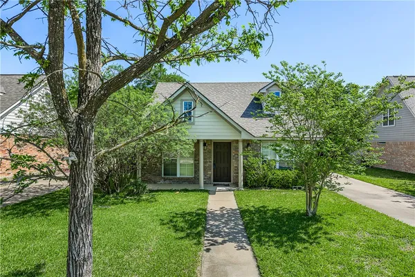 a house with a tree in front of it