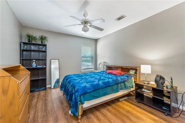 a kitchen with a refrigerator and a stove top oven