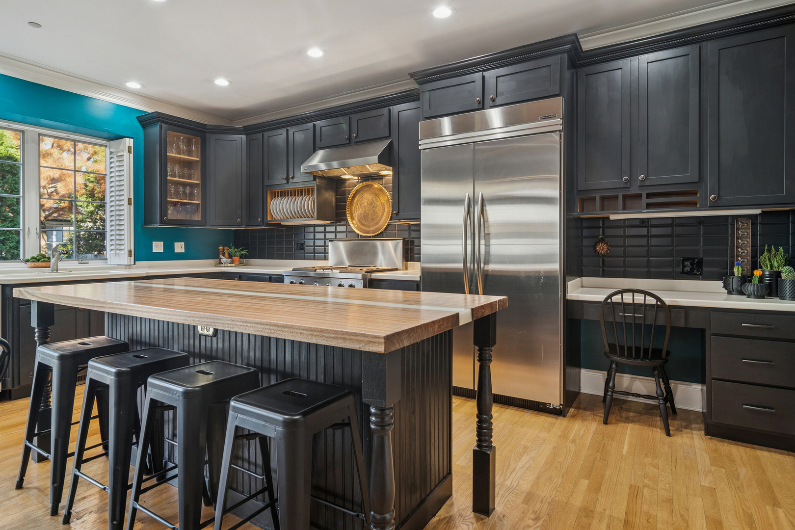 320 Washington Street Barrington, IL 60010 - Photo 7 of 34 a kitchen with stainless steel appliances granite countertop a sink a stove and a refrigerator