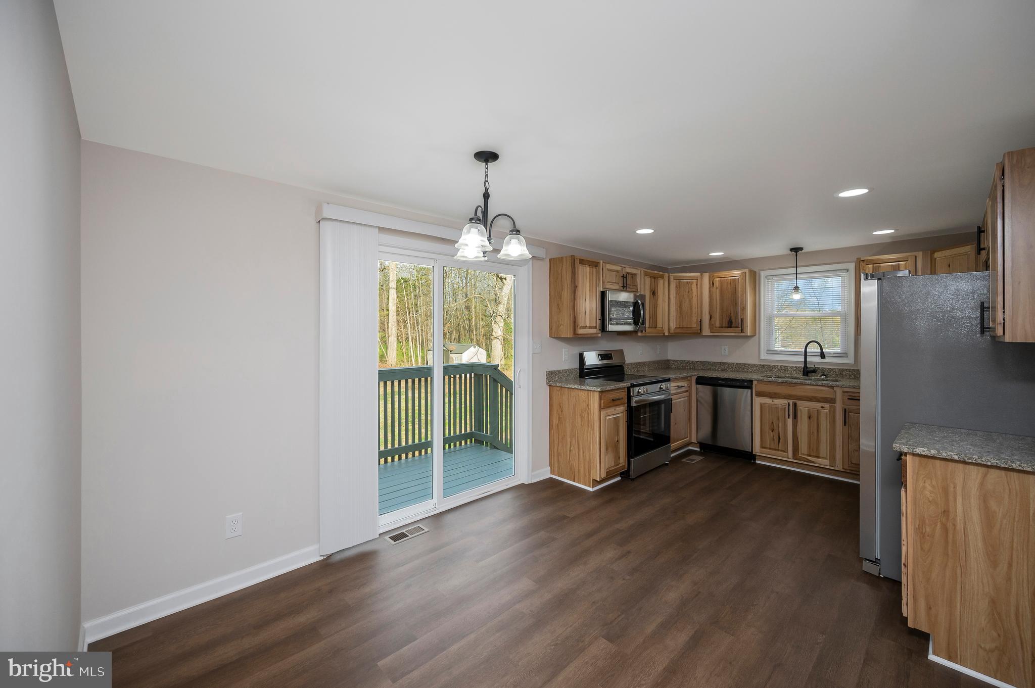 5200 Hams Ford Road Woodford, VA 22580 - Photo 12 of 51 a large kitchen with a lot of counter space and stainless steel appliances