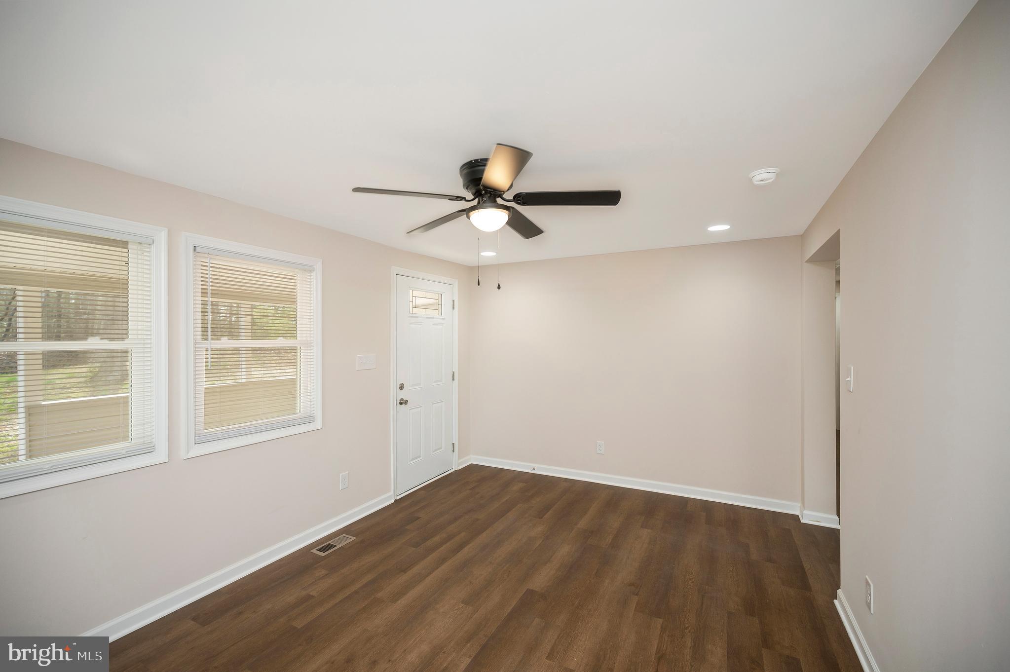 5200 Hams Ford Road Woodford, VA 22580 - Photo 17 of 51 wooden floor in an empty room with a window