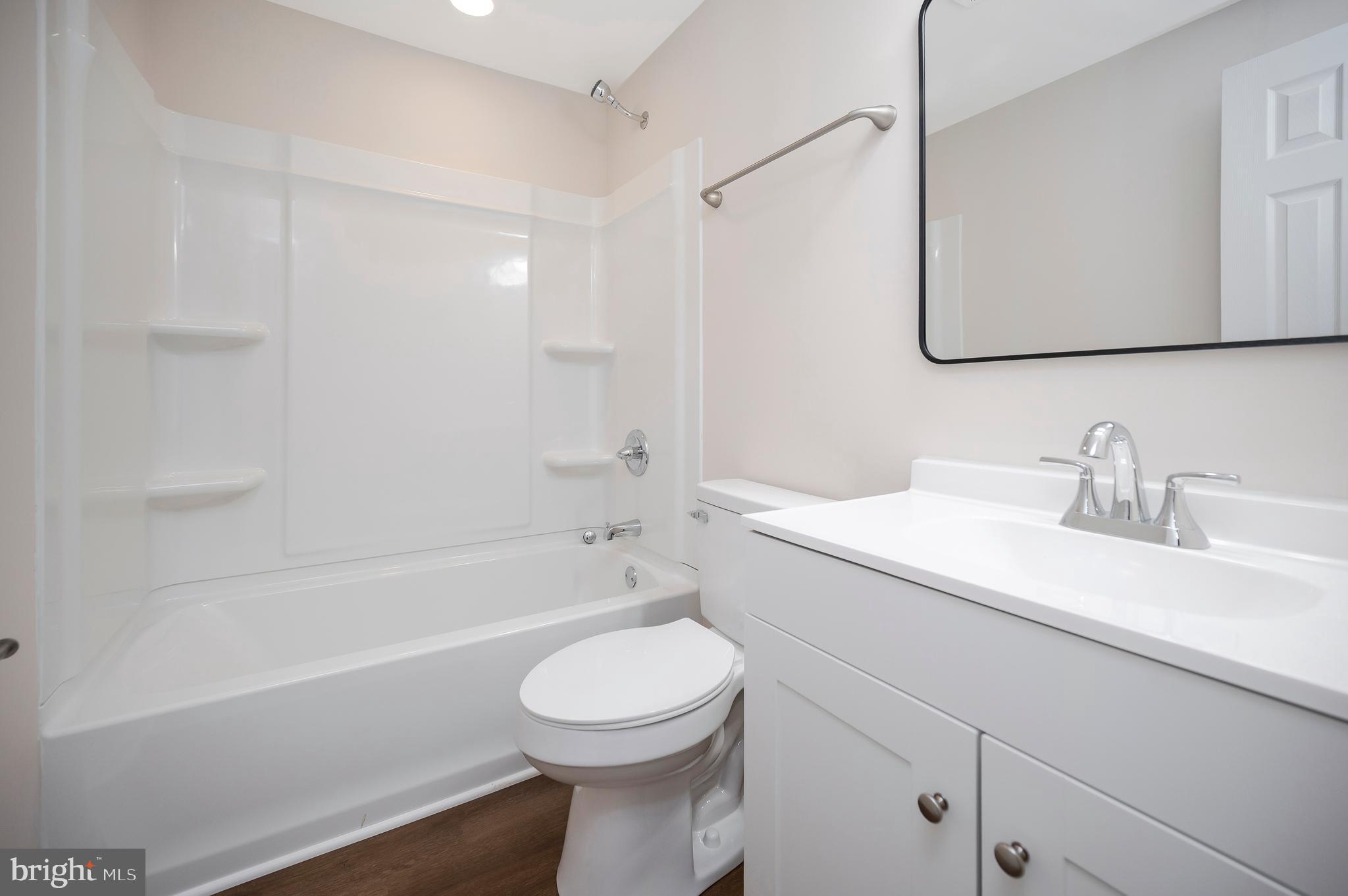 5200 Hams Ford Road Woodford, VA 22580 - Photo 28 of 51 a bathroom with a sink a toilet and shower