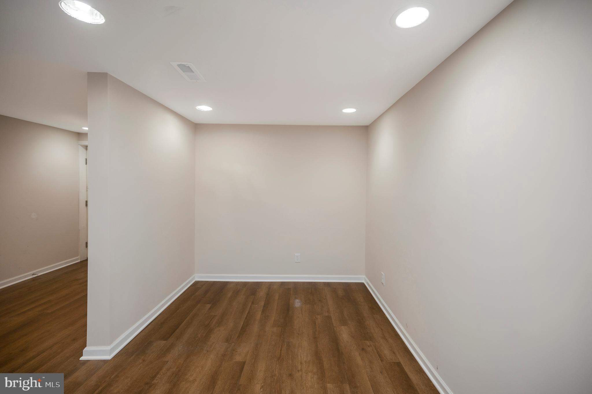 5200 Hams Ford Road Woodford, VA 22580 - Photo 35 of 51 a view of hallway with wooden floor