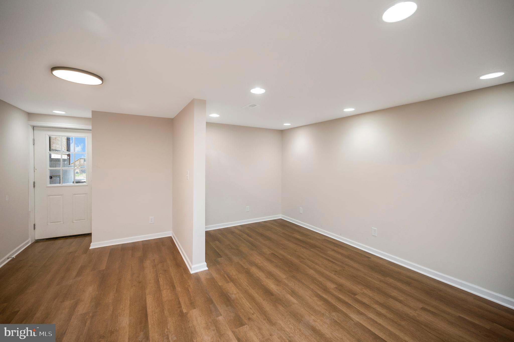 5200 Hams Ford Road Woodford, VA 22580 - Photo 36 of 51 a view of empty room with wooden floor