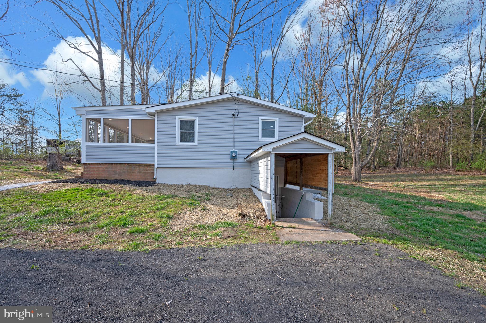 5200 Hams Ford Road Woodford, VA 22580 - Photo 47 of 51 a front view of a house with garden