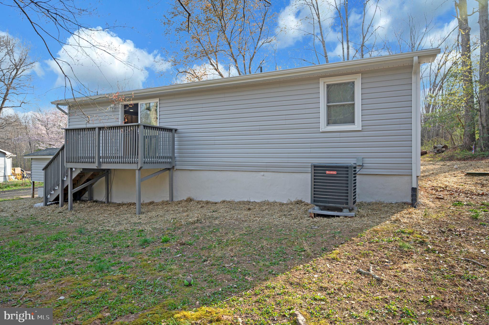 5200 Hams Ford Road Woodford, VA 22580 - Photo 49 of 51 a backyard of a house with table and chairs