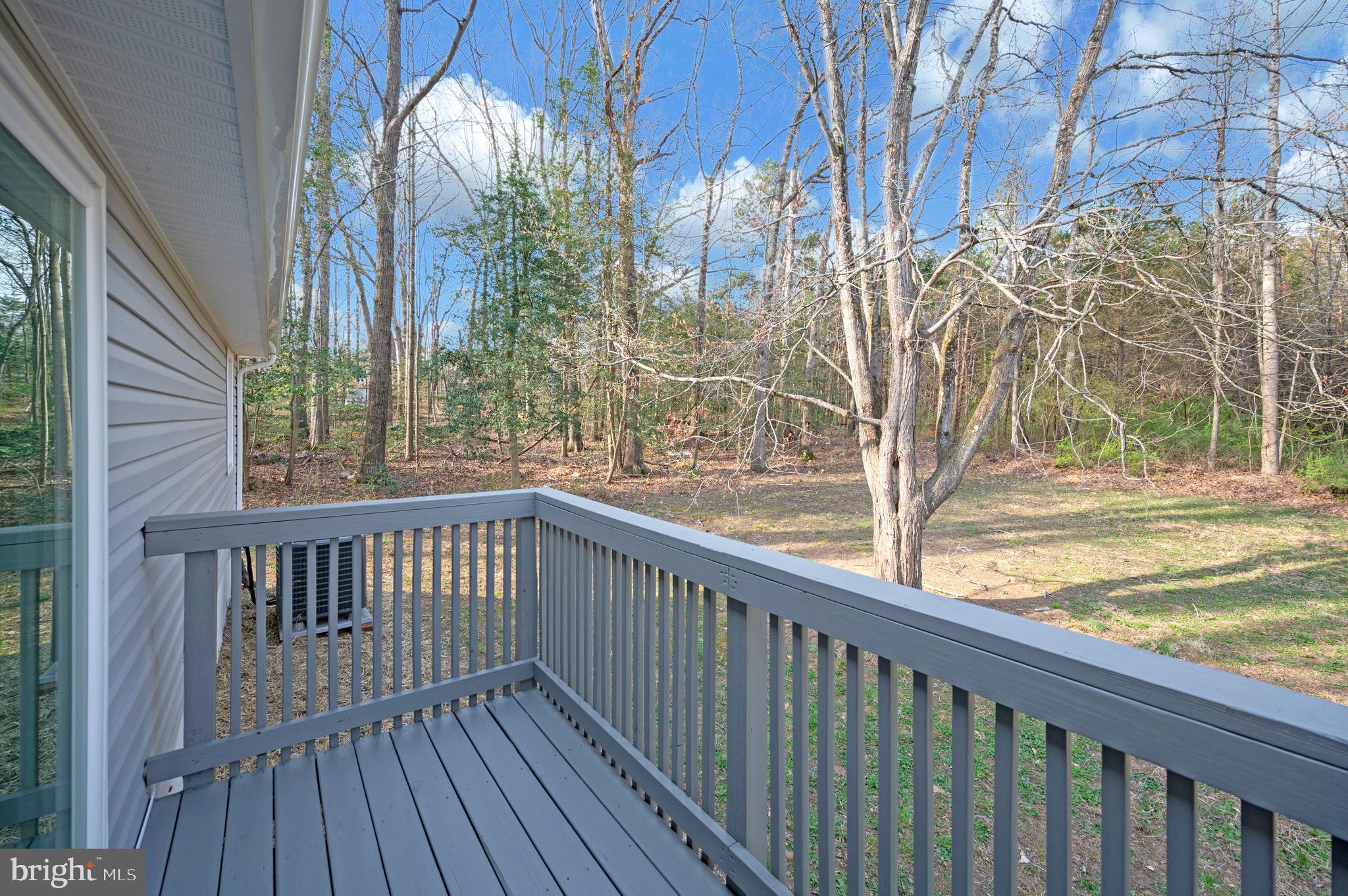 5200 Hams Ford Road Woodford, VA 22580 - Photo 51 of 51 a view of roof deck with wooden floor and fence