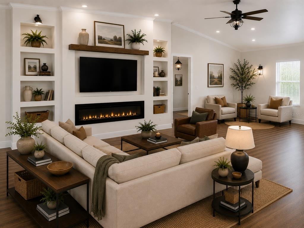 9412 Noddy Tern Road Weeki Wachee, FL 34613 - Photo 6 of 35 a living room with furniture a flat screen tv and a fireplace