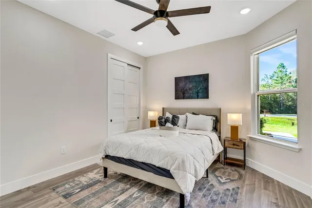 a bedroom with a bed and a window