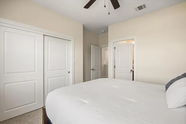 a utility room with wooden floor washer and dryer