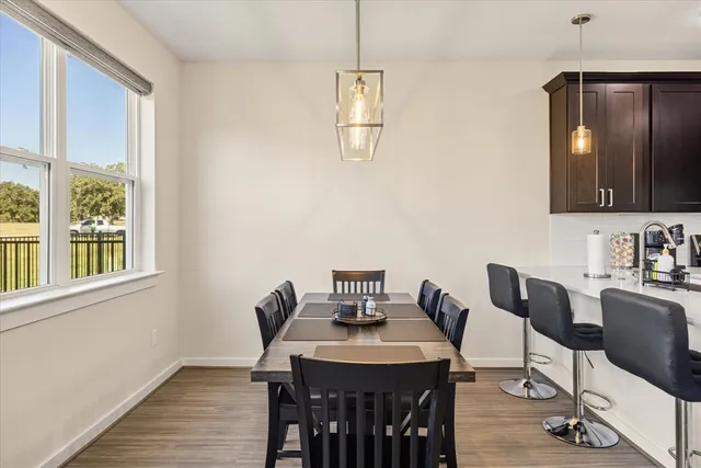 a view of a dining room with furniture window and outside view