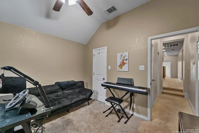 a room with a bed and a television