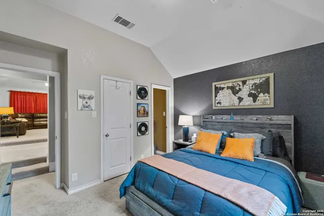 a en suite bathroom with a sink double vanity and a mirror