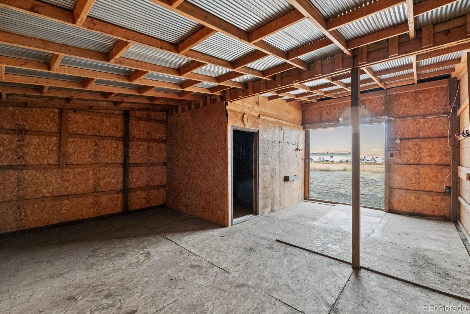 21105 McDaniels Road Calhan, CO 80808 - Photo 24 of 32 a view of a garage room