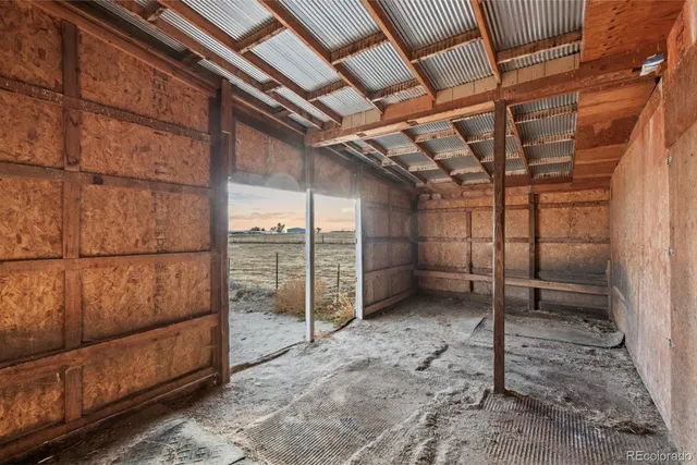 a view of a room with wooden walls