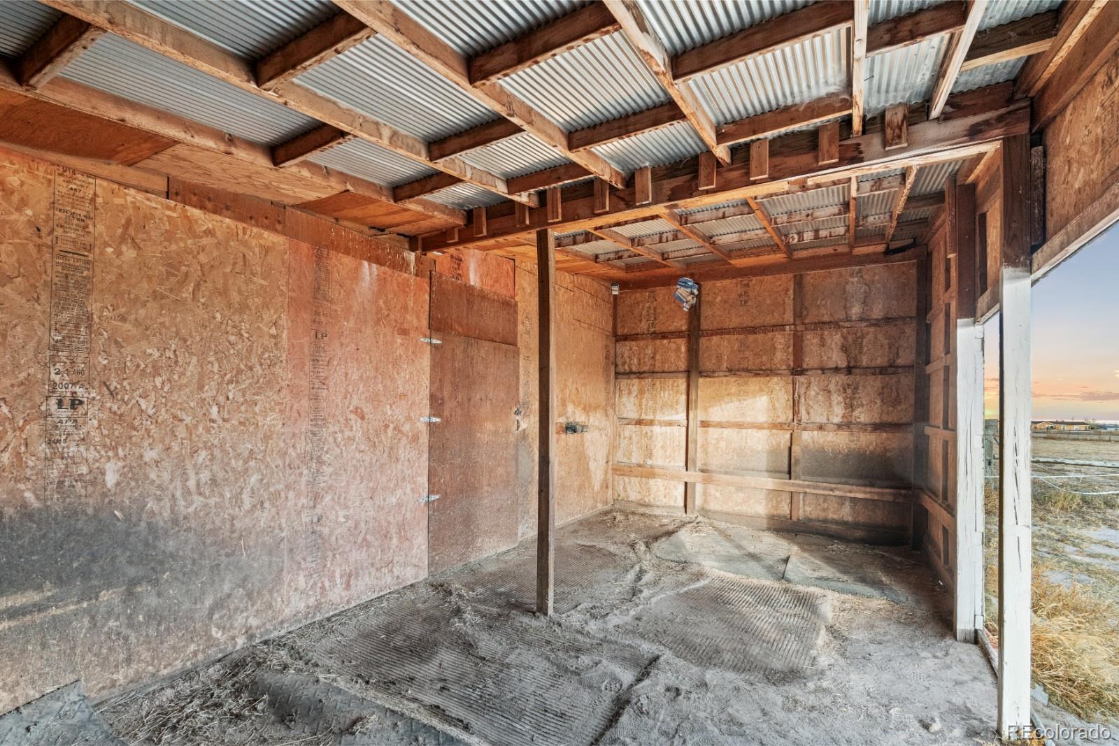 21105 McDaniels Road Calhan, CO 80808 - Photo 26 of 32 a view of a room with wooden walls