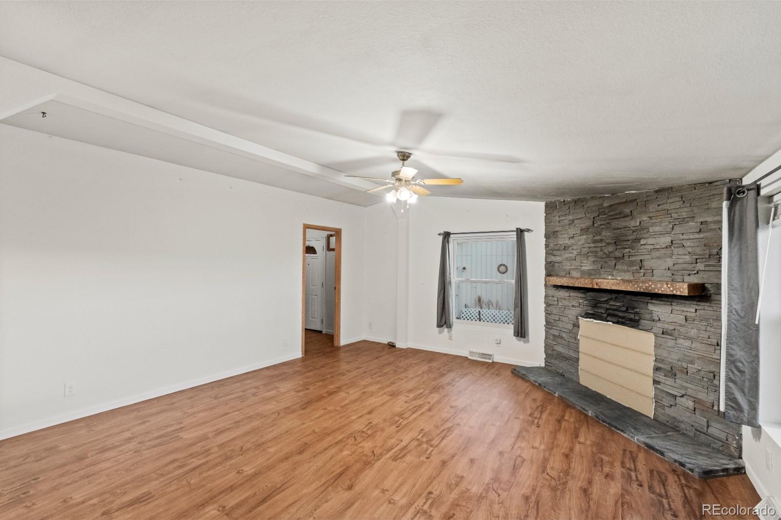 21105 McDaniels Road Calhan, CO 80808 - Photo 6 of 32 a view of an empty room with a window