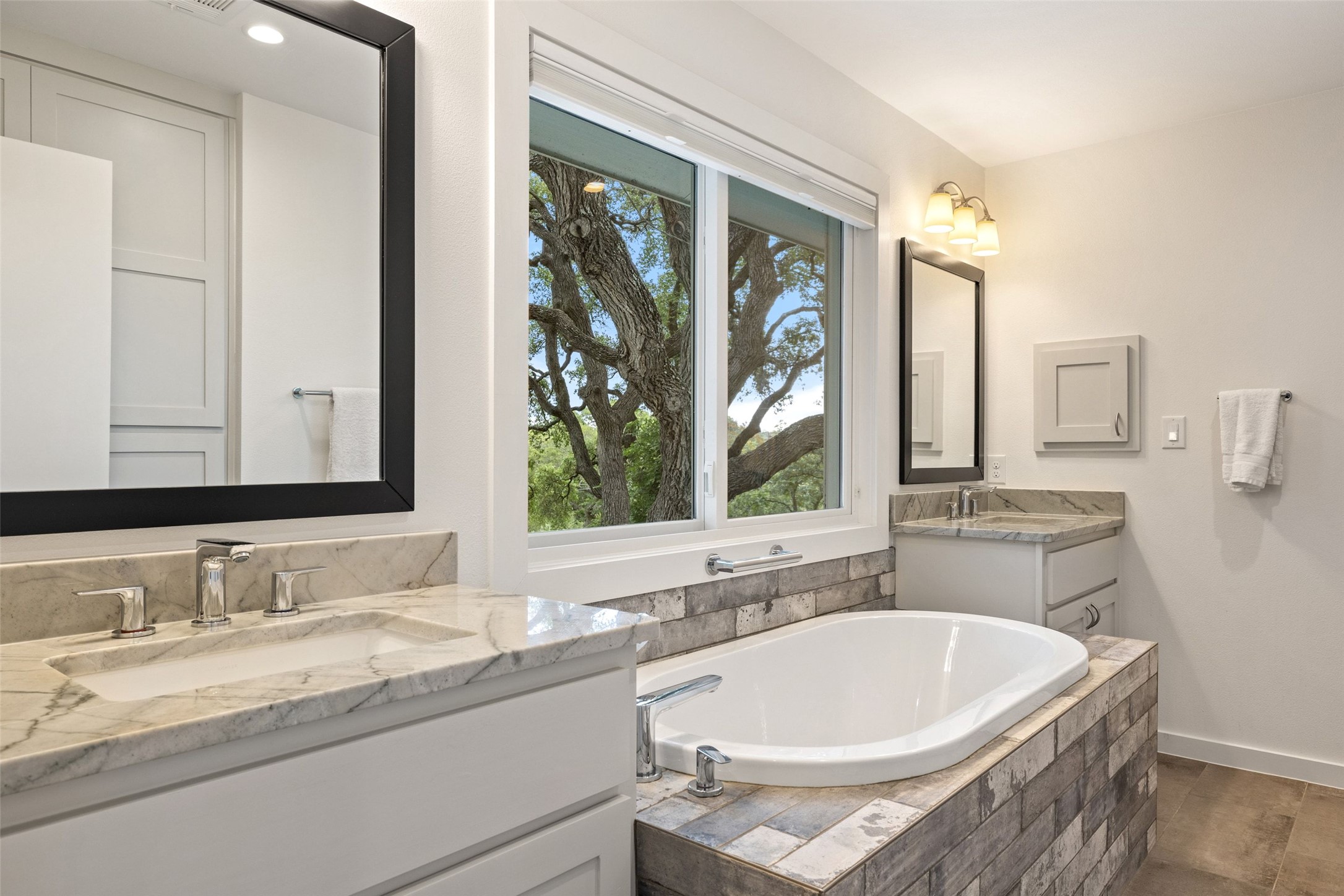 701 River Road Blanco, TX 78606 - Photo 22 of 38 a bathroom with a bathtub and a sink