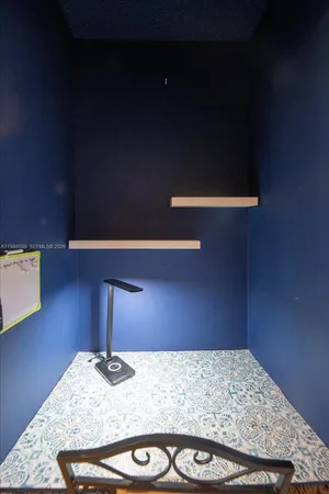 a bathroom with a granite countertop sink and vanity