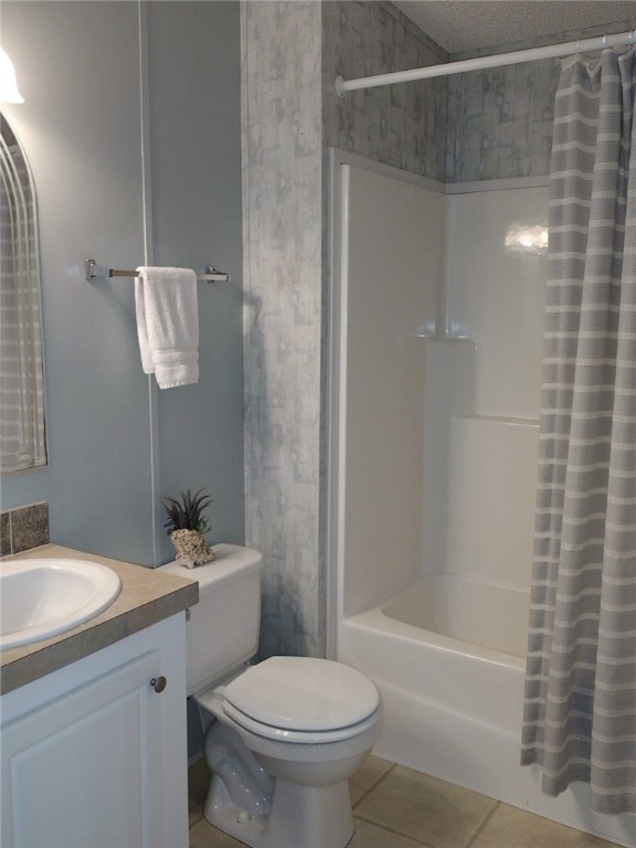 7490 133rd Place Sebastian, FL 32958 - Photo 15 of 25 a bathroom with a shower a toilet and sink