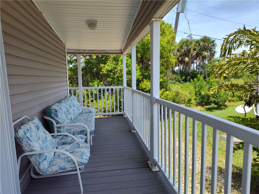 7490 133rd Place Sebastian, FL 32958 - Photo 17 of 25 a balcony with furniture