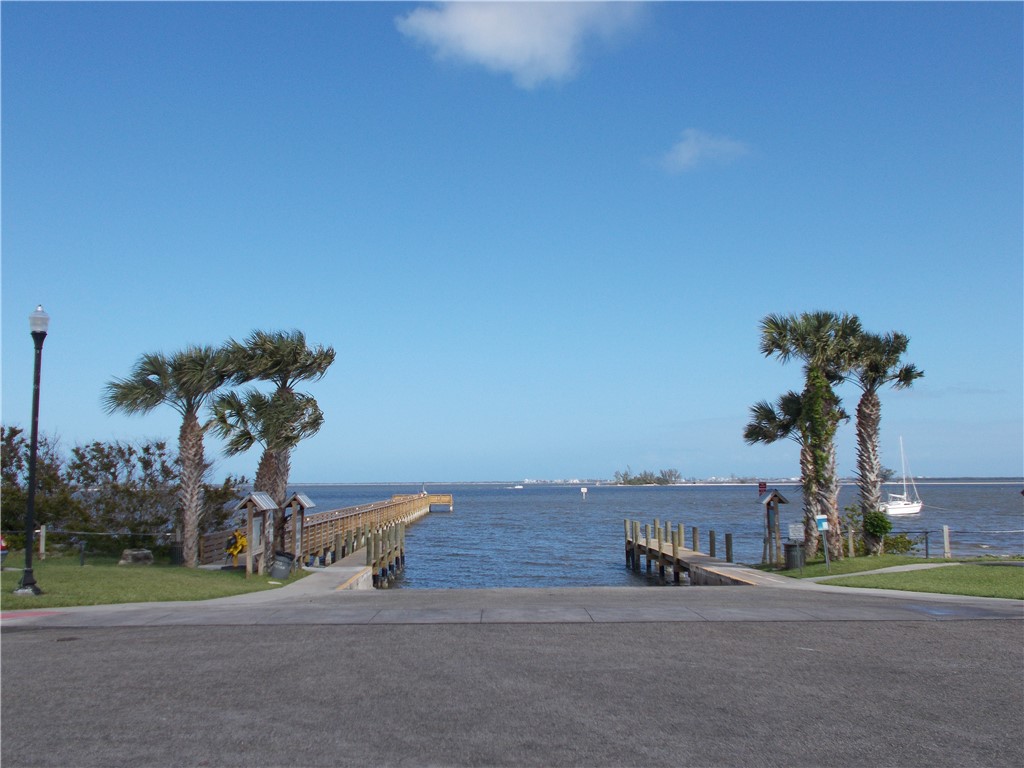 7490 133rd Place Sebastian, FL 32958 - Photo 23 of 25 a view of a park with a bench and trees
