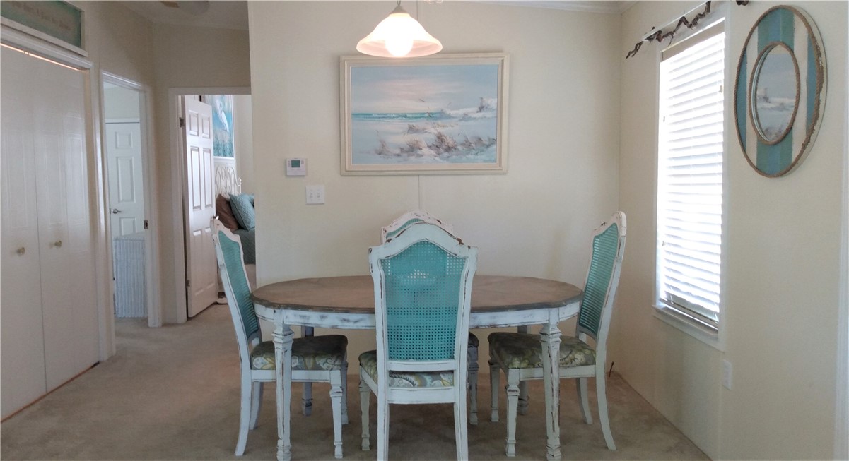 7490 133rd Place Sebastian, FL 32958 - Photo 8 of 25 a view of a dining room with furniture and a window