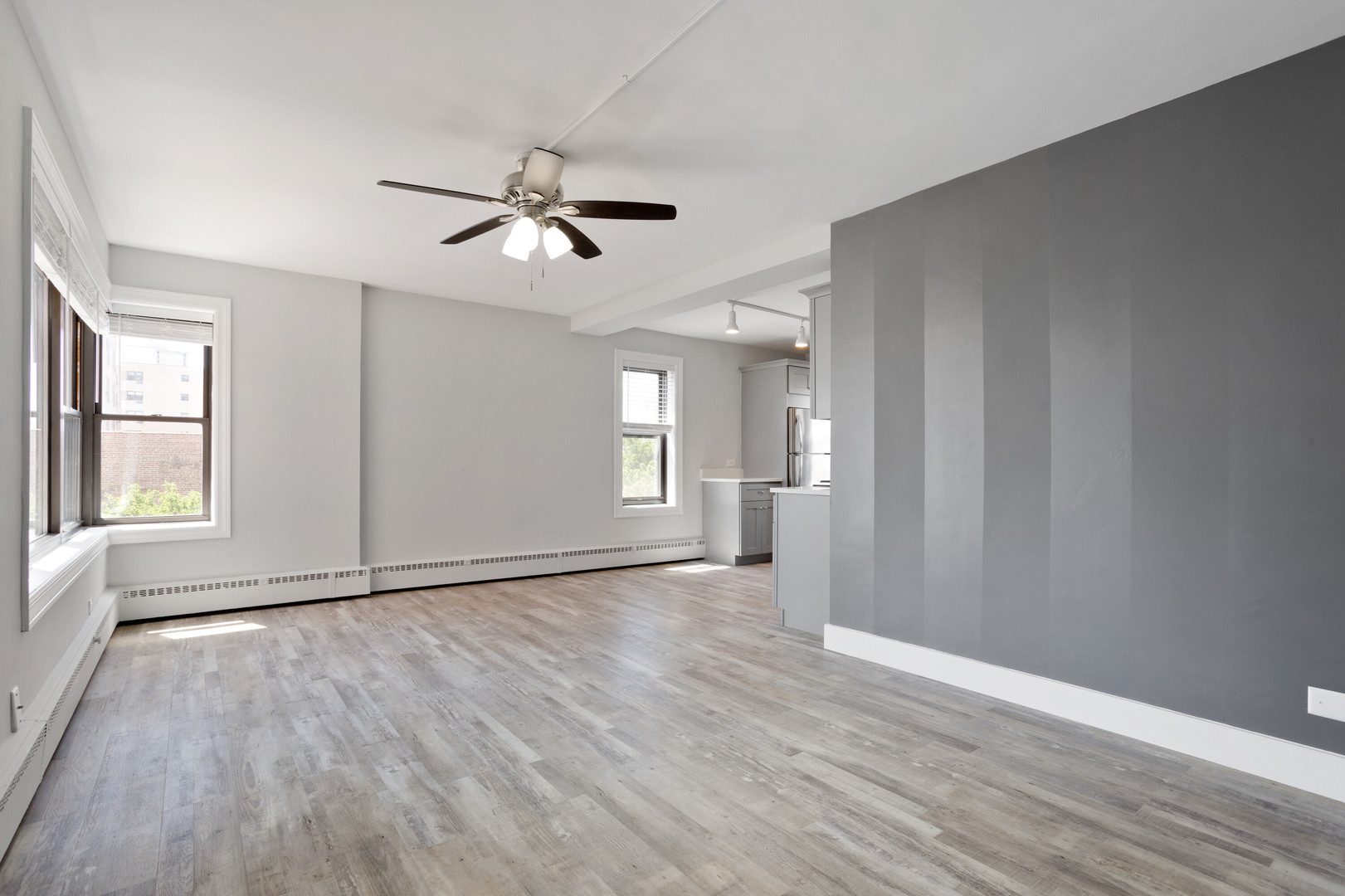 5858 North Sheridan Road, Unit 508 Chicago, IL 60660 - Photo 5 of 17 a view of empty room with wooden floor and fan
