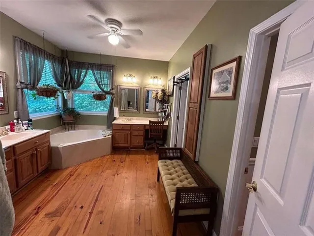 a bathroom with a double vanity sink and mirror