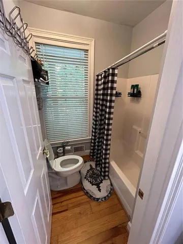 a living room with furniture and a lamp