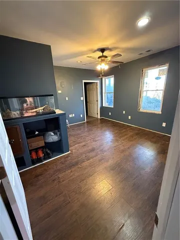a view of a livingroom with wooden floor