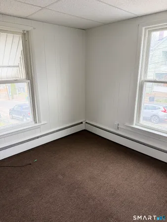 a view of an empty room and window