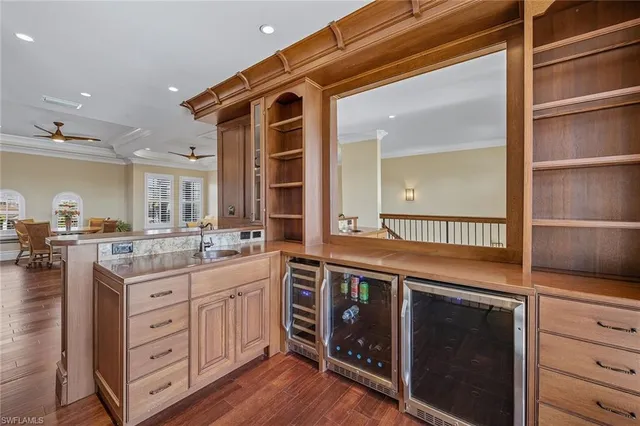 a kitchen with a stove a sink and cabinets