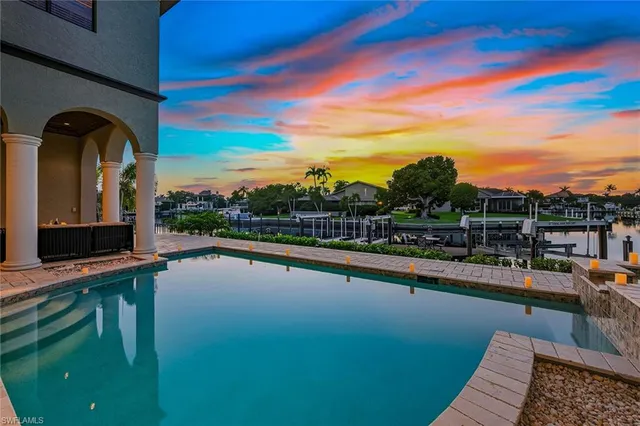 a view of a swimming pool with a lounge chair