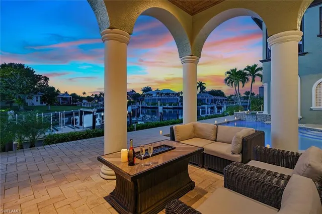a view of roof deck with couches and city view
