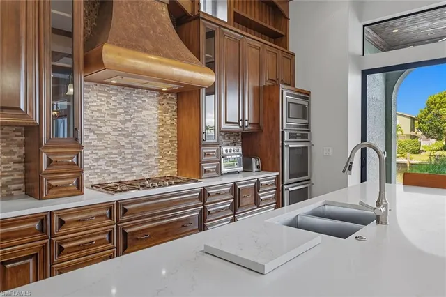 a view of living room kitchen and entryway