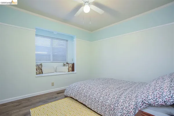 a room with furniture and wooden floor