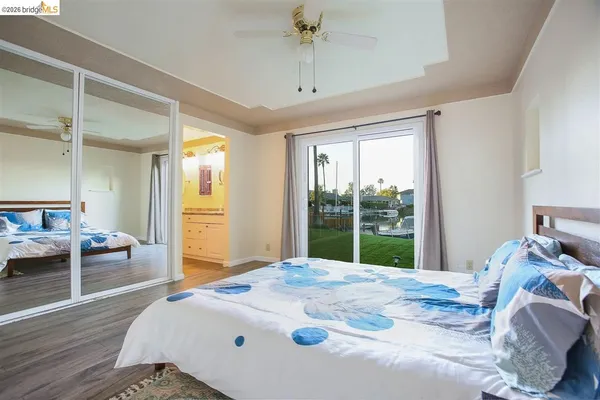 a view of bedroom with furniture and wooden floor