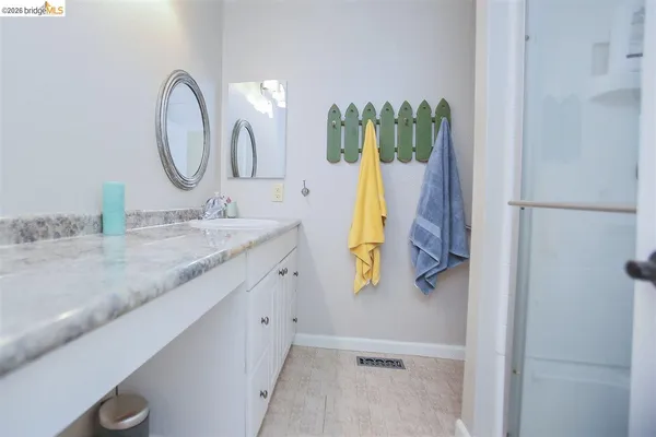 a bedroom with a bed and sky view