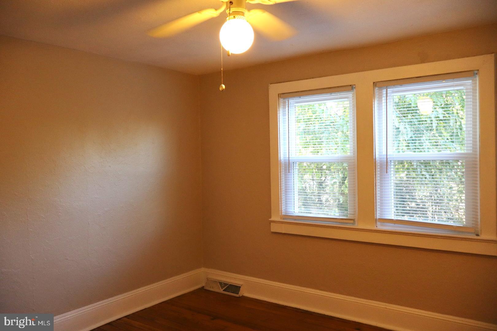 37 Moran Avenue Princeton, NJ 08542 - Photo 13 of 15 a view of an empty room with wooden floor and a window