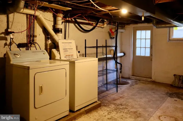 a view of a storage & utility room with washer and dryer