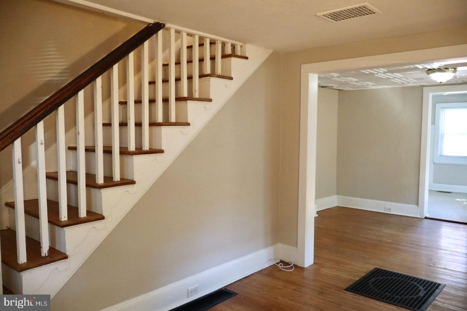 37 Moran Avenue Princeton, NJ 08542 - Photo 3 of 15 a view of staircase with lots of frames on wall and wooden floor