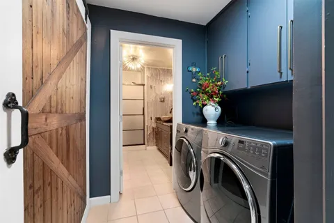 a view of storage and utility room with washer and dryer