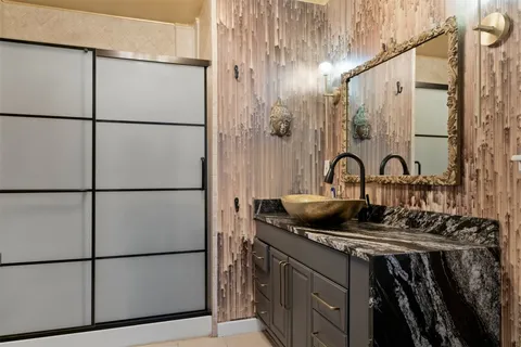 a kitchen with a refrigerator and a sink