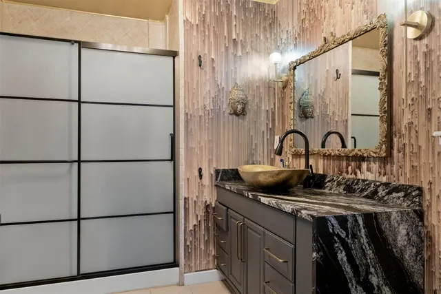 a kitchen with a refrigerator and a sink