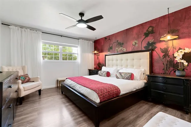 a bedroom with a bed and window