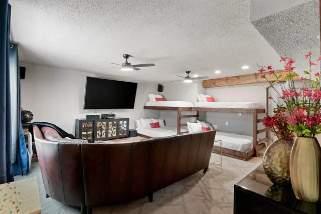 a living room with furniture and flat screen tv