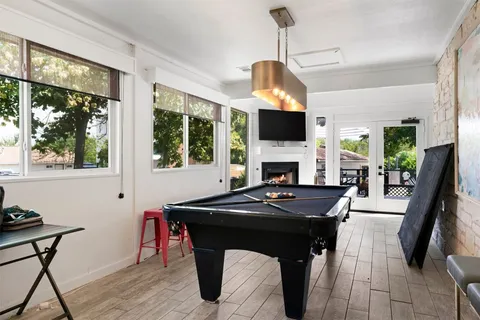 a view of a livingroom with furniture window and wooden floor